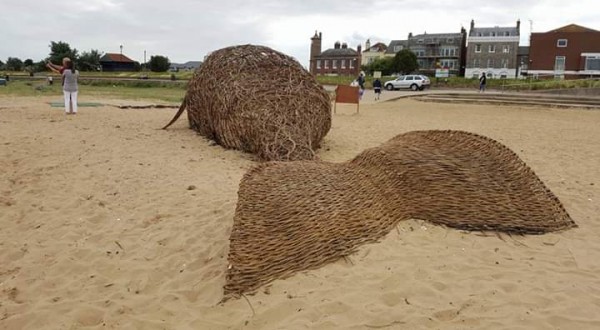 Willow whale for the arts Festival 2017 on Harwich Beach. on The Saturday when it was nearly finished I put the plastic bags in there for peoples awareness of the affects of plastic pollution on the wildlife which is particularly bad I the sea. The whale was 15 meters long and as the tide came in and moved it around for its slow disintegration the local school children would come along on their way home from school and repair it, its now replaced by the German U-boat.